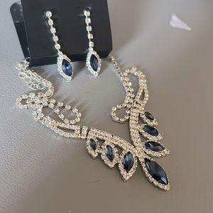 this necklace is dark blue and it comes with the same earrings, the same color.